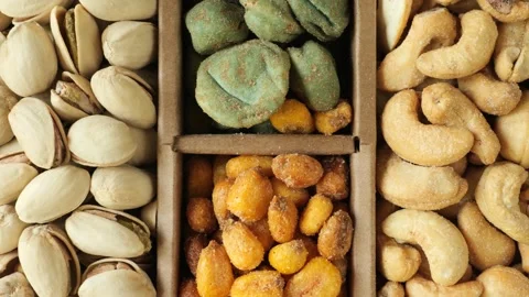 Assortment of nuts and snacks slowly moving Stock Footage 341281040