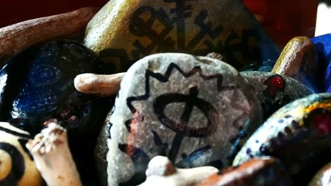 Assortment painted Viking drawing patterned spiritual stones colourful Stock Footage 158932231