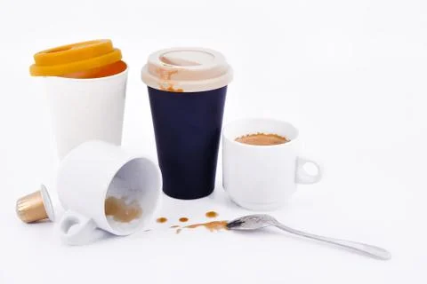 Assortment of paper coffee cups, regular coffee cups with a metal spoon and a Stock Photos