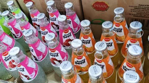 An assortment of Pran Basil Seed drinks in lychee and orange flavors, displ.. Stock Photos