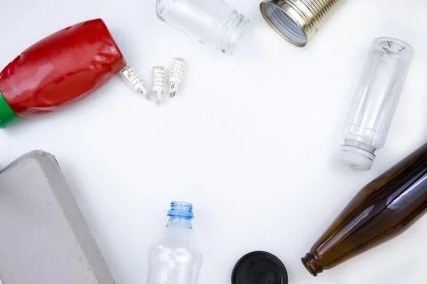 Assortment of Recyclable Materials on a White Surface Stock Photos