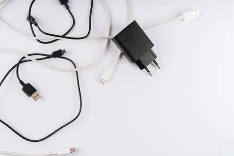 Assortment of Tangled USB Charging Cables, Including Type-C, Micro-USB, and.. Stock Photos
