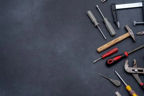 Assortment of Tools Equipment implement on Dark Background Stock Photos