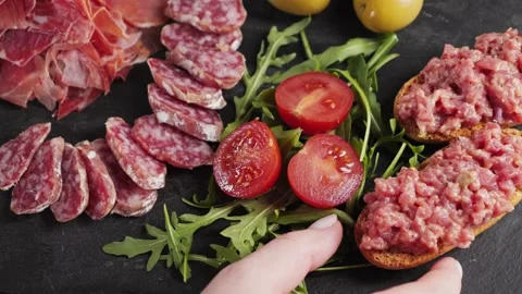 Assortment of various tasty Spanish appetizers. Meat, dried sausage, olives Stock Footage 336059111