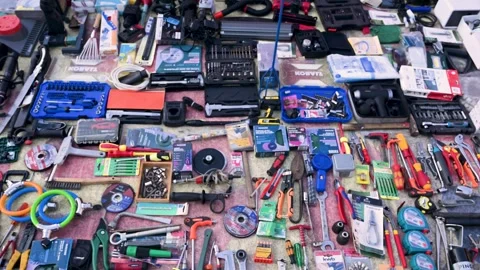 Assortment of various tools and hardware neatly for sale on flea market. Stock Footage 345498847