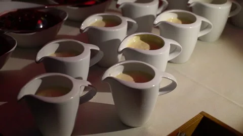 Assortment Of White Ceramic Teacups With Warm Liquid Stock Footage 294979462