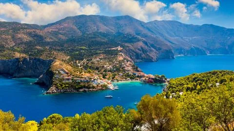 Assos village in Kefalonia, Greece. Turquoise colored bay in Mediterranean se Stock Photos
