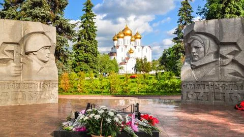 Assumption Cathedral framed between statues of a soldier and a farmer - Russia Stock Photos