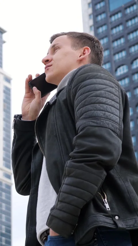 Assured Outdoor Talk. Man In Jacket Skillfully Negotiates Outdoors Confidently Vídeos de archivo 333441771