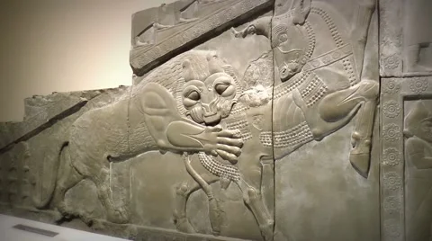 Assyrian lion attacks bull facade Stock Footage 50670344