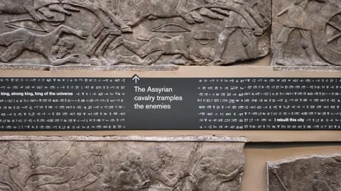 Assyrian relief showing cavalry trampling enemies, with cuneiform inscription Stock Footage 317734677