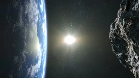 An asteroid dangerously approaches the Earth from the right. Starry sky. 4K Stock Footage 141389360