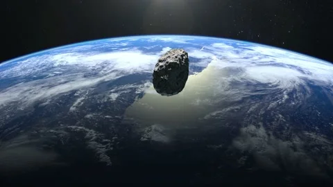 The asteroid falls to Earth. An asteroid appears in the frame, rotates and Stock Footage 141002111