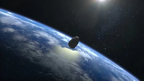 An asteroid falls to Earth. The asteroid spins and flies rapidly towards Earth Stock Footage 141002182