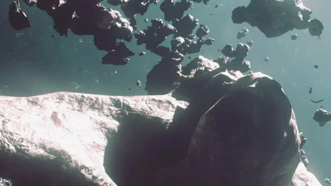 Asteroid field in outer space with rocks floating and light shining Stock Footage 344405711