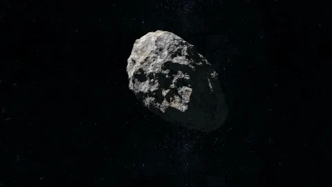 The asteroid flies and spins in space. The camera rotates in the orbit of the Stock-Footage 140469677