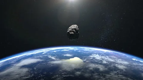 An asteroid flies close to the Earth. Asteroid appears in the frame, rotates and Stock Footage