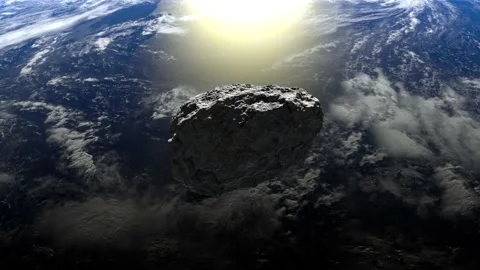 The asteroid flies over the Earth and rotates slowly. 4K. 3d rendering. Stock Footage 141389310