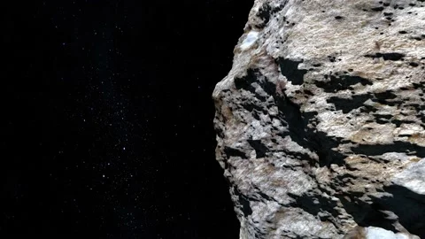 The asteroid flies in space. The asteroid slowly flies away from the right Stock-Footage 144071696