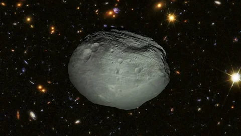 Asteroid Flying through the Universe Stock Footage 107123461