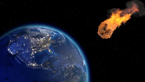 Asteroid Impact on Earth. Asteroid, comet, meteorite glows, enters the earth's Vídeos de archivo 129663360