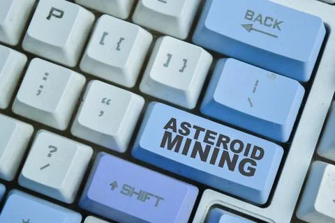 Asteroid mining on the button keyboard. For hypothetical exploitation Stock Photos