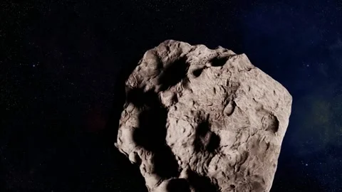 Asteroid moving through space. Elements of this video furnished by NASA Stock Footage 227286921