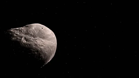 Asteroid in orbit around planet Stock Footage 133210844