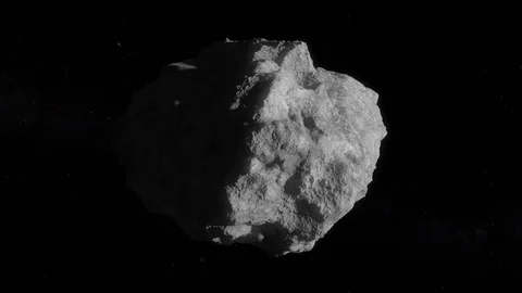 Asteroid rotating slowly in space 4K Vidéo 82833619