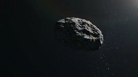 Asteroid in space. The asteroid flies and rotates slowly. Starry sky. 4K. Stars Stock Footage 140469644