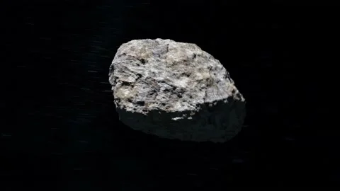 Asteroid in space. Stars twinkle. The asteroid flies from afar, flies near the Stock Footage 140469695