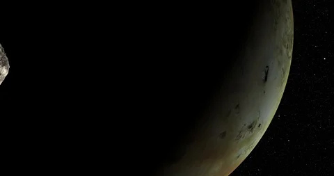 An asteroid tumbles slowly in space as it passes Io. Video stock 91708224