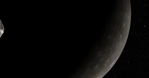 An asteroid tumbles slowly in space as it passes Mercury. Video stock 91708591
