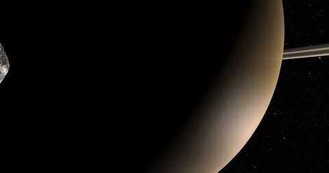An asteroid tumbles slowly in space as it passes Saturn. Stock Footage 91709258