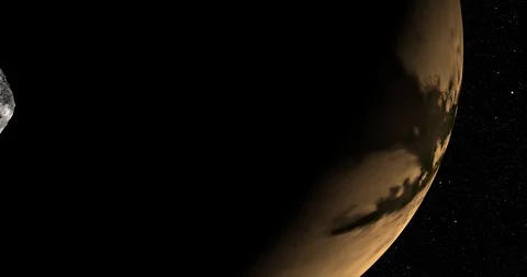 An asteroid tumbles slowly in space as it passes Titan. Stock Footage 91709353