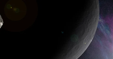 An asteroid tumbles slowly in space as it passes Ceres. Lens effects, nebulae Stock Footage 91798070