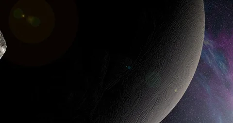An asteroid tumbles slowly in space as it passes Enceladus. Lens fx, nebulae Stock Footage 91798174
