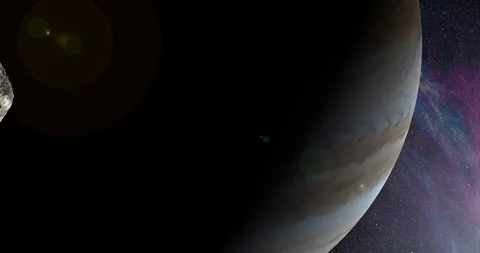 An asteroid tumbles slowly in space as it passes Jupiter. Lens fx, nebulae Video stock 91798441