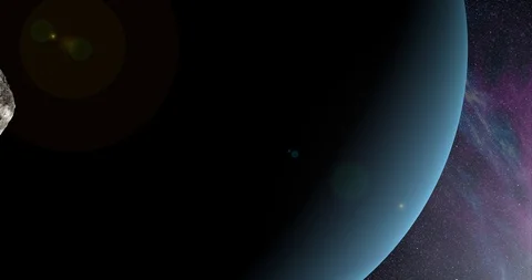 An asteroid tumbles slowly in space as it passes Uranus. Lens fx, nebulae Stock Footage 91799098