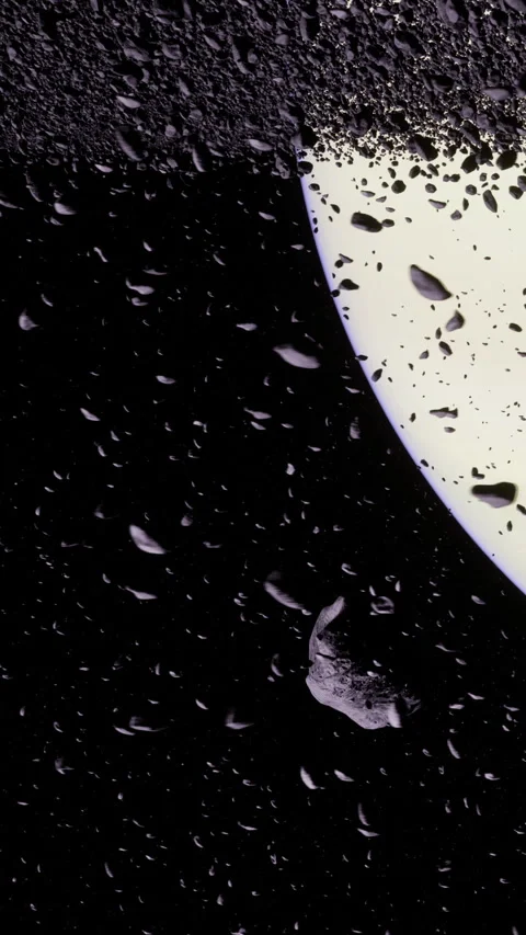Asteroids dance in the dark sky near a luminous planet Stock Footage 331824511