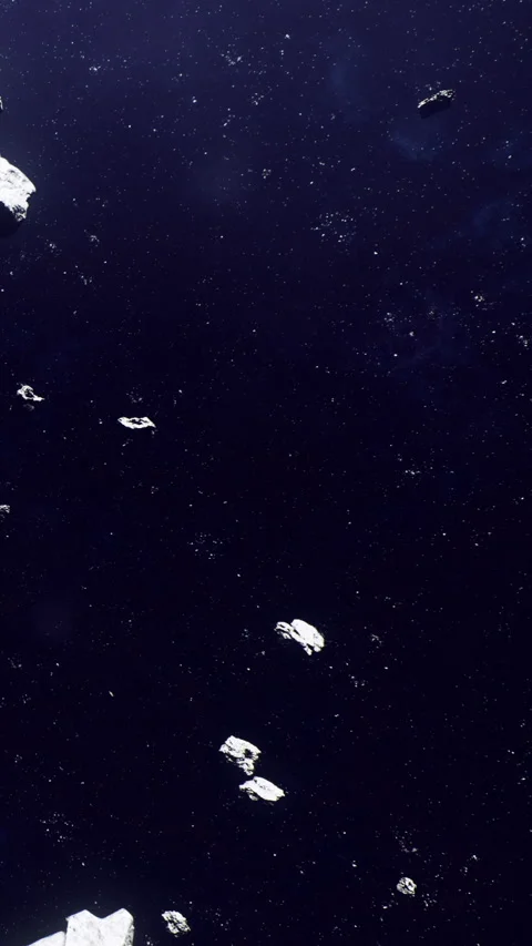 Asteroids float in dark space near distant stars in a cosmic setting Stock Footage 339954000