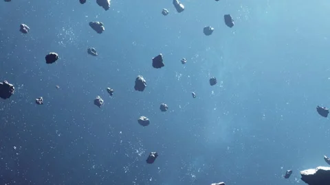 Asteroids floating in space above the blue surface of a distant planet Stock Footage 343540768