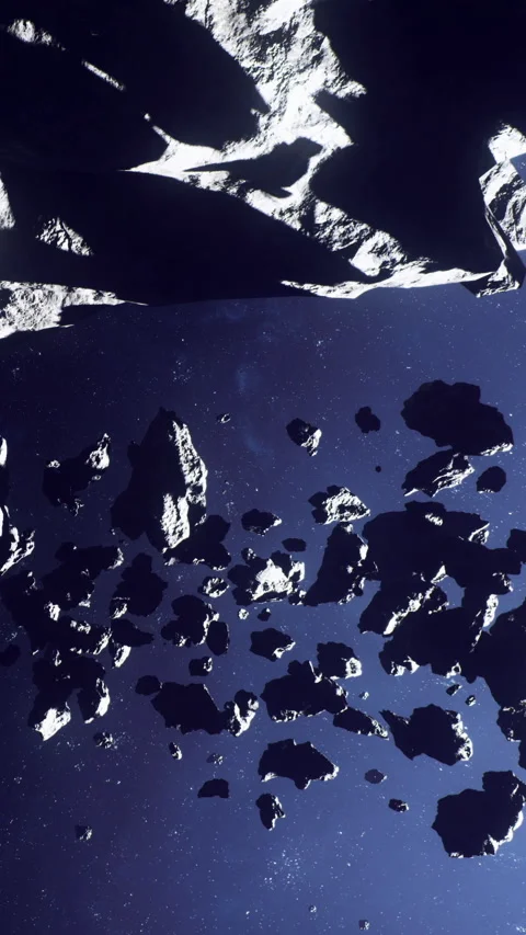 Asteroids floating in space with dark background and distant stars visible Stock Footage 339957811