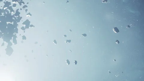 Asteroids floating in space with distant stars in the background Stock Footage 345063082