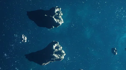 Asteroids floating in space with stars and darkness surrounding them Stock Footage 345062745