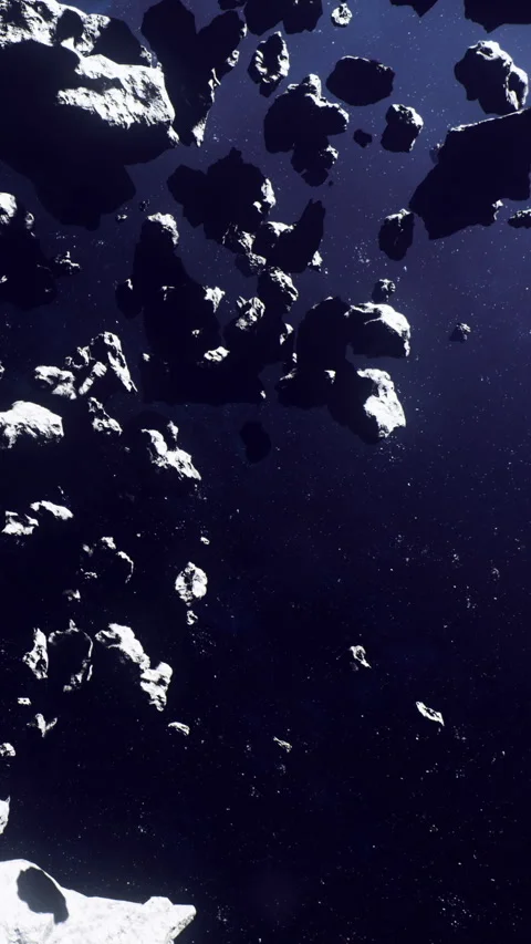 Asteroids in space moving across a dark background near distant stars Stock Footage 334310898