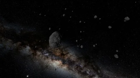Asteroids Travelling Through Space Towards Star Stock Footage 99734903