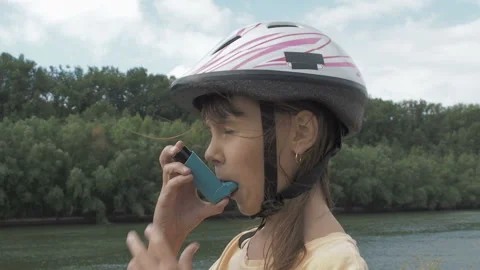 Asthma attack. Allergy. Cyclist with inhaler. Stock Footage