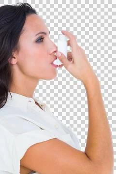 Asthmatic brunette using her inhaler Stock Photos