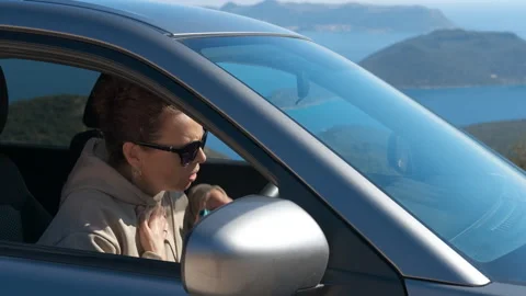 Asthmatic woman using inhaler during attack while driving Stock Footage 345482400